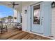 Inviting front porch with rocking chairs and light blue door at 1617 Bowsprit Ct, Mount Pleasant, SC 29466