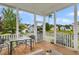 Screened porch with wooden deck, outdoor furniture, and a view of a backyard at 1617 Bowsprit Ct, Mount Pleasant, SC 29466