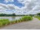 Peaceful waterfront path with lush landscaping at 1617 Bowsprit Ct, Mount Pleasant, SC 29466