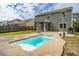 Backyard with a pool, green lawn, an outdoor grill, and back of the home at 1708 Indaba Way, Charleston, SC 29414