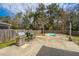 Backyard with a small pool, grilling station, patio, and a wooden fence at 1708 Indaba Way, Charleston, SC 29414