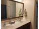 Double vanity bathroom with large mirror and dark wood cabinets at 1708 Indaba Way, Charleston, SC 29414