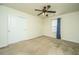 This bedroom has carpeted floors, a ceiling fan, a window with blinds, and a closet with sliding doors at 1708 Indaba Way, Charleston, SC 29414