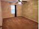 Simple bedroom with carpeted floor, window with blinds, and ceiling fan at 1708 Indaba Way, Charleston, SC 29414