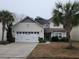 Two-story house featuring a neutral color scheme and a two-car garage at 1708 Indaba Way, Charleston, SC 29414