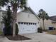 White two-car garage with decorative hardware at 1708 Indaba Way, Charleston, SC 29414
