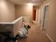 Upstairs hallway with carpeted flooring and access to bedrooms at 1708 Indaba Way, Charleston, SC 29414