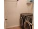 Laundry room with washer and dryer and overhead shelving at 1708 Indaba Way, Charleston, SC 29414