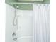 This shower features a shower head, green walls, and a white shower curtain at 1708 Indaba Way, Charleston, SC 29414