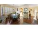 Charming dining area with hardwood floors and a view into the kitchen at 1915 Marsh Oak Ln, Seabrook Island, SC 29455