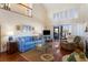 Open living area with hardwood floors, high ceilings, and access to a balcony at 1915 Marsh Oak Ln, Seabrook Island, SC 29455