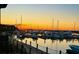 Stunning sunset over the marina with many boats at 1915 Marsh Oak Ln, Seabrook Island, SC 29455