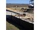 Construction site featuring heavy machinery, and construction materials, with a glimpse of waterfront potential at 2038 Ironstone Aly # 17, Charleston, SC 29407