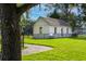 Image of a small, whitewashed outbuilding with a dark roof, surrounded by a fence and lawn at 2038 Ironstone Aly # 17, Charleston, SC 29407