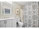 Clean bathroom with white vanity, shower/tub combo, and mandala patterned shower curtain at 2262 Folly Rd # 2-K, Charleston, SC 29412