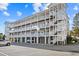 Three-story building with multiple balconies and parking at 2262 Folly Rd # 2-K, Charleston, SC 29412