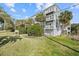 Building exterior showcasing landscaping and walkway at 2262 Folly Rd # 2-K, Charleston, SC 29412