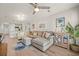 Bright living room with sectional sofa, wood floors, and coastal decor at 2262 Folly Rd # 2-K, Charleston, SC 29412