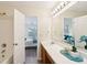 Clean bathroom with a vanity, mirror, and access to bedroom at 232 Mallory Dr, Charleston, SC 29414