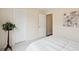 Bright bedroom with carpeted floor, double doors, and decorative wall art at 232 Mallory Dr, Charleston, SC 29414