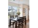Dining area with dark wood table and chairs, window views, and light decor at 232 Mallory Dr, Charleston, SC 29414