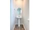 Small bathroom with pedestal sink and circular mirror at 238 Wathen Dr, Goose Creek, SC 29445