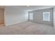 Well-lit bedroom with neutral walls and carpet flooring at 238 Wathen Dr, Goose Creek, SC 29445