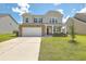 Two-story house with stone accents, a front porch, and a well-maintained lawn at 238 Wathen Dr, Goose Creek, SC 29445