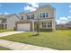 Two-story house with stone accents, a front porch, and a well-maintained lawn at 238 Wathen Dr, Goose Creek, SC 29445