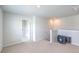 Upstairs loft area with carpet, TV, and access to bathroom and closet at 238 Wathen Dr, Goose Creek, SC 29445