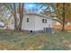 Backyard with a cozy shed, an efficient AC unit, and lush greenery, all shaded by mature trees, promoting outdoor enjoyment at 2664 Hull St, North Charleston, SC 29405