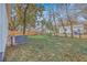 A spacious backyard featuring a shed, an efficient AC unit, and secure fencing, creating a private outdoor oasis at 2664 Hull St, North Charleston, SC 29405