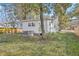 Backyard with a cozy shed, an efficient AC unit, and lush greenery, all shaded by mature trees, promoting outdoor enjoyment at 2664 Hull St, North Charleston, SC 29405