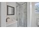 Nicely decorated bathroom with vanity, framed mirror and shower with transparent curtain at 2664 Hull St, North Charleston, SC 29405