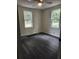 Bright bedroom with two windows and gray vinyl flooring at 2664 Hull St, North Charleston, SC 29405