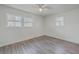 Bright and spacious bedroom with two windows, hard surface floors and neutral decor at 2664 Hull St, North Charleston, SC 29405
