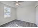 Cozy bedroom features natural light, ceiling fan, closet, neutral walls, and hard surface flooring at 2664 Hull St, North Charleston, SC 29405