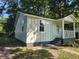 Renovated cottage with new siding and landscaping at 2664 Hull St, North Charleston, SC 29405
