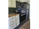 Modern kitchen with stainless steel appliances and stone backsplash at 2664 Hull St, North Charleston, SC 29405