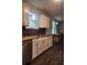 Modern kitchen featuring white cabinets and wood countertops at 2664 Hull St, North Charleston, SC 29405