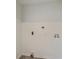 A simple utility area or laundry room with essential hookups and plain white walls at 2664 Hull St, North Charleston, SC 29405