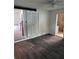 Spacious bedroom with dark gray flooring and barn door at 2664 Hull St, North Charleston, SC 29405