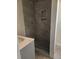 Modern shower with marble-look tile and built-in shelves at 2664 Hull St, North Charleston, SC 29405
