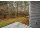 Private backyard view of wooded area with a small patio at 275 Jackson St, Goose Creek, SC 29445
