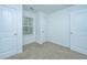 Bright bedroom featuring neutral walls, carpet, and ample closet space at 275 Jackson St, Goose Creek, SC 29445