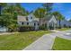 Charming community clubhouse with welcoming entryway and landscaping at 275 Jackson St, Goose Creek, SC 29445