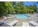 Relaxing community pool with plenty of lounge chairs and umbrellas at 275 Jackson St, Goose Creek, SC 29445
