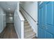 Light-colored entryway with carpeted stairs and blue door at 275 Jackson St, Goose Creek, SC 29445