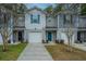 Gray townhouses with teal doors and white garages at 275 Jackson St, Goose Creek, SC 29445