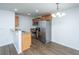 Kitchen with wood cabinets, granite counters, and stainless steel appliances at 275 Jackson St, Goose Creek, SC 29445